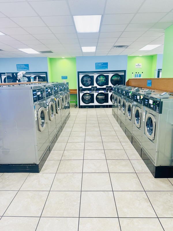 Aisle between two rows of high-efficiency washers at Express Laundry Center in Knoxville